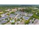 Community aerial showcasing residential buildings, green spaces, and a central pool area at 704 Grado Pt, Oviedo, FL 32765