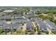 Aerial view of townhouses in a neighborhood with tree landscaping and greenery at 704 Grado Pt, Oviedo, FL 32765