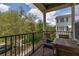 Outdoor balcony featuring a table with chairs and railing with green view of the landscape at 704 Grado Pt, Oviedo, FL 32765