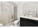 Modern bathroom featuring glass enclosed shower, vanity, and mirror at 704 Grado Pt, Oviedo, FL 32765