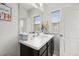 Bright bathroom featuring a window, a vanity with solid surface counters, and lots of natural light at 704 Grado Pt, Oviedo, FL 32765