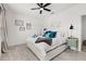 Cozy bedroom with a ceiling fan, comfortable bed, and playful decor at 704 Grado Pt, Oviedo, FL 32765