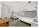 Bright bedroom featuring bunk beds, a ceiling fan, and a large window at 704 Grado Pt, Oviedo, FL 32765