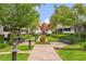 A central courtyard with manicured landscaping, benches and brick walkways at 704 Grado Pt, Oviedo, FL 32765