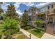 Inviting two-story townhome with a well-manicured front yard and a cozy balcony, offering a comfortable living space at 704 Grado Pt, Oviedo, FL 32765