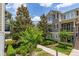 Attractive townhome with beautifully landscaped grounds and inviting curb appeal, offering a comfortable lifestyle at 704 Grado Pt, Oviedo, FL 32765