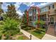 Inviting two-story townhome with a well-manicured front yard and a cozy balcony, offering a comfortable living space at 704 Grado Pt, Oviedo, FL 32765