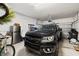 Organized garage with vehicle, storage, and equipment at 704 Grado Pt, Oviedo, FL 32765