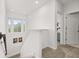 Bright hallway featuring plush carpeting and access to multiple rooms upstairs at 704 Grado Pt, Oviedo, FL 32765