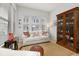 A cozy living room featuring natural light, stylish furnishings, and warm wood floors at 704 Grado Pt, Oviedo, FL 32765