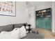Living room showcasing a comfortable gray sectional sofa and custom shelving at 704 Grado Pt, Oviedo, FL 32765