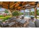Relaxing outdoor lounge area featuring stylish seating and a view of the sparkling community pool at 704 Grado Pt, Oviedo, FL 32765