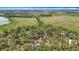 High-angle view of a property nestled among lush trees, waterways, and adjacent wetlands at 7374 Circle Dr, Lady Lake, FL 32159