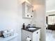 This bathroom has a white vanity with a black countertop at 7374 Circle Dr, Lady Lake, FL 32159