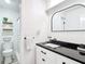 Stylish bathroom featuring black countertop, modern fixtures, and a shower at 7374 Circle Dr, Lady Lake, FL 32159