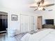 This bedroom includes wood-look floors and closet doors at 7374 Circle Dr, Lady Lake, FL 32159