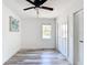 Bedroom featuring wood-look flooring and a window at 7374 Circle Dr, Lady Lake, FL 32159