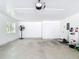 Inside the clean garage is a window, utility door, and electric service at 7374 Circle Dr, Lady Lake, FL 32159