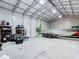 Spacious metal garage featuring ample room for boat storage and additional shelving at 7374 Circle Dr, Lady Lake, FL 32159