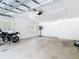 This bright, clean two car garage has two windows and a utility door at 7374 Circle Dr, Lady Lake, FL 32159