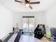 Bright home gym with fitness equipment and large window views at 7374 Circle Dr, Lady Lake, FL 32159