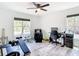 Bright and spacious home gym featuring exercise equipment and natural light streaming through a large window at 7374 Circle Dr, Lady Lake, FL 32159