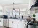 A modern kitchen featuring stainless steel appliances, sleek countertops, and a bright, airy atmosphere at 7374 Circle Dr, Lady Lake, FL 32159