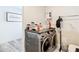 Modern laundry room with washer, dryer, and folding space at 7374 Circle Dr, Lady Lake, FL 32159