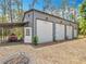 A large metal outbuilding has multiple bays, covered area, and easy access at 7374 Circle Dr, Lady Lake, FL 32159