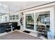 Cozy covered patio with sliding door and outdoor seating area at 7374 Circle Dr, Lady Lake, FL 32159