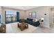 Serene living room extends to a private balcony with amazing views and comfortable outdoor seating area at 7565 Laureate Blvd # 3408, Orlando, FL 32827