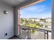 Balcony view showcasing the community's landscape, architecture, and blue skies at 7565 Laureate Blvd # 3408, Orlando, FL 32827