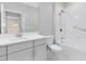 Clean bathroom featuring a single vanity with white countertops and a shower-tub combo at 7565 Laureate Blvd # 3408, Orlando, FL 32827