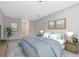 Spacious bedroom with light gray walls, ceiling fan, and blue accents at 7565 Laureate Blvd # 3408, Orlando, FL 32827
