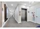This bright hallway features neutral decor and elevator access, providing a clean and functional living space at 7565 Laureate Blvd # 3408, Orlando, FL 32827