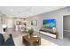 Inviting living room connects seamlessly to dining and kitchen areas creating an airy and functional design at 7565 Laureate Blvd # 3408, Orlando, FL 32827
