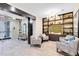 This is a well-decorated lobby with comfortable seating and a decorative bookshelf, creating an inviting resident space at 7565 Laureate Blvd # 3408, Orlando, FL 32827