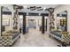 This is a well decorated lobby with unique ceiling decor and decorative mirrors, offering residents an inviting space at 7565 Laureate Blvd # 3408, Orlando, FL 32827