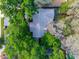 Aerial view of a home surrounded by lush greenery offering privacy and a serene environment at 819 E Harbour Ct, Ocoee, FL 34761