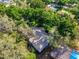 Aerial view of a home with lush green trees, providing ample shade and privacy at 819 E Harbour Ct, Ocoee, FL 34761