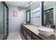 Beautiful bathroom with dual sinks, granite countertops, and a tiled shower at 819 E Harbour Ct, Ocoee, FL 34761