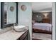 Bathroom featuring neutral paint, a granite countertop, and access to the bedroom at 819 E Harbour Ct, Ocoee, FL 34761