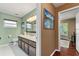 Bathroom features a granite countertop, an updated vanity, and a toilet at 819 E Harbour Ct, Ocoee, FL 34761