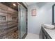 Elegant bathroom with a walk-in shower and a granite countertop sink at 819 E Harbour Ct, Ocoee, FL 34761