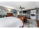 Large primary bedroom features a comfortable seating area with wooden accents at 819 E Harbour Ct, Ocoee, FL 34761