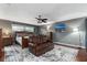 Spacious bedroom featuring wood accents, a seating area, and a ceiling fan at 819 E Harbour Ct, Ocoee, FL 34761