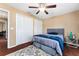 Bedroom featuring hardwood floors, ceiling fan and closet at 819 E Harbour Ct, Ocoee, FL 34761