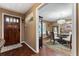 Dining room featuring a glass table with hardwood floors, natural lighting, and neutral walls at 819 E Harbour Ct, Ocoee, FL 34761