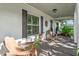Inviting front porch featuring seating and painted brick exterior at 819 E Harbour Ct, Ocoee, FL 34761