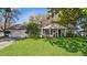 Charming single story home featuring a well manicured lawn, inviting front porch and attached garage at 819 E Harbour Ct, Ocoee, FL 34761